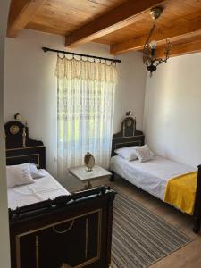 a bedroom with two beds and a window at Country house Todor in Kragujevac +53 photos