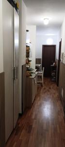 a room with a kitchen with a hard wood floor at Alla fiera di Roma in Ponte Galeria