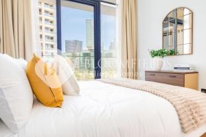 Postel nebo postele na pokoji v ubytování Bloomfields Elegant 1Br in Al Maryah Island