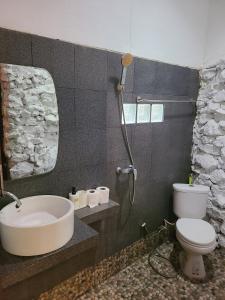 a bathroom with a sink and a toilet and a shower at Cozy house by the sea in Ko Phangan +18 photos