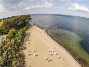 an aerial view of a beach with umbrellas on it at Bungalow in Damshagen nahe der Ostsee in Reppenhagen