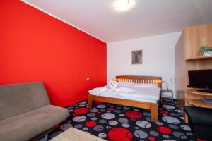 A bed or beds in a room at Penzion Raj