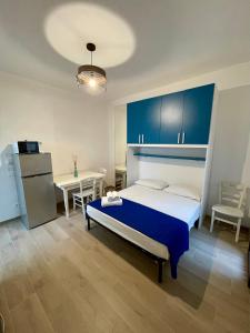 Postel nebo postele na pokoji v ubytování Sant Isidoro Apartments