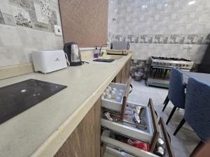 a kitchen with a sink and a counter top at hajer221 in Al Hofuf +5 photos