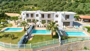 an aerial view of a house with two swimming pools at Sunlight Villas Heated Pool in Mathés +32 photos