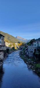 a river in a town with houses and buildings at Casa Giulia in Isolabona