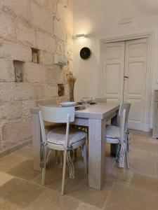 a dining room with a table and chairs at Civico 39 in Ostuni