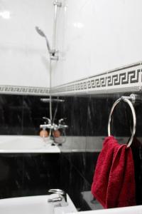 a bathroom with a sink and a red towel at Seaside 2 Bedrooms Villa - IMI OUADDAR in Agadir