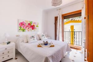 Ένα ή περισσότερα κρεβάτια σε δωμάτιο στο Casa Elodí, 3 beautiful apartments and 1 private studio in Sayalonga +111 φωτογραφίες