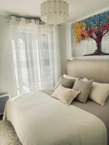 En eller flere senge i et værelse på Le Bougainvillier