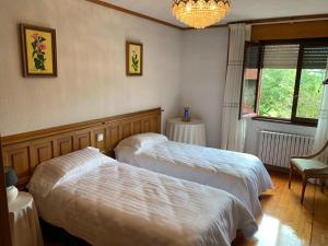 Postel nebo postele na pokoji v ubytování La Casa de la Carpintería