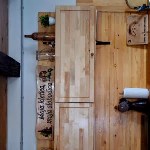 a wooden door with a sign on a wall at Kuća za odmor Matovilka in Križevci +29 photos
