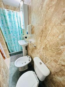 a bathroom with a toilet and a sink at Manuel Apart in Esquina +20 photos