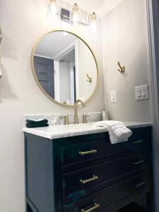 a bathroom with a sink and a mirror at Little Bit-A-Cozy, 2BR Retreat in Hickory