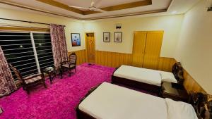 Highland Club Balakot客房内的一张或多张床位