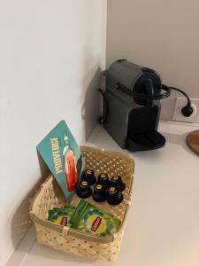 a basket of food and a toaster on a counter at 014 Studio Provençal - Proche d'Aix en Provence in Éguilles