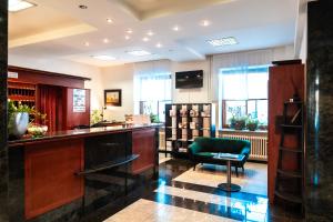 TV a/nebo společenská místnost v ubytování Hotel Grand