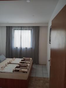 Postel nebo postele na pokoji v ubytování Apartman Boračko jezero LOTUS