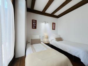 Ένα ή περισσότερα κρεβάτια σε δωμάτιο στο Los Pinos