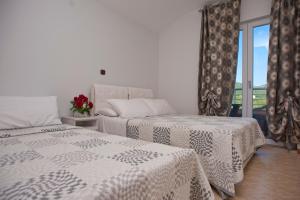 Postel nebo postele na pokoji v ubytování Apartments Gold