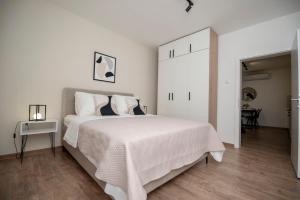 Ένα ή περισσότερα κρεβάτια σε δωμάτιο στο Azzurro Apartments with Swimming pool & Jacuzzi +27 φωτογραφίες