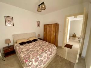 a bedroom with a bed and a door to a hallway at Cairo Madinty 2 in Madinaty