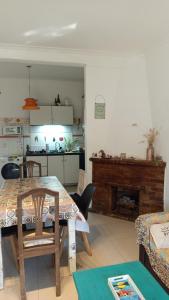 a living room with a table and a fireplace at Casa Olivos in Olivos