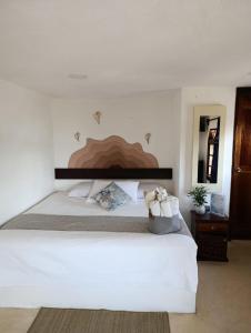 Postel nebo postele na pokoji v ubytování Hotelito Crismi