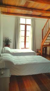 Postel nebo postele na pokoji v ubytování Loft Casa Yucay