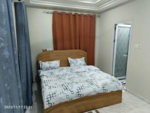 a bedroom with a bed with music notes on it at 2 bedroom Apartment - East legon in Accra