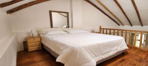 Postel nebo postele na pokoji v ubytování Loft Casa Yucay