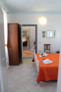 A bed or beds in a room at B&B Is Janas E5391 Még 37 kép