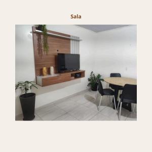 TV a/nebo společenská místnost v ubytování Apartamento Mobiliado
