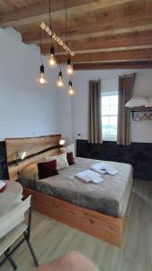 a bedroom with a large bed with towels on it at Basalto Negro AL in Angra do Heroísmo +42 photos