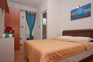 Postel nebo postele na pokoji v ubytování Apartments Gold + 34 fotografií