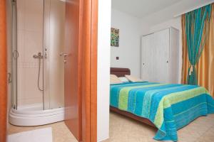 Postel nebo postele na pokoji v ubytování Apartments Gold