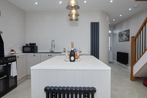 a kitchen with a white counter top in a room at No32 Carmarthen Road in Llandeilo