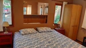 a bedroom with a bed with two pillows on it at Loft 35 metros cuadrados in Mar de las Pampas
