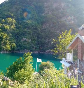 a view of a lake with a mountain in the background at Norral shelter 1 in Kajvall +9 photos