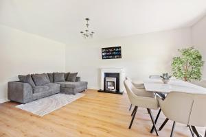 a living room with a couch and a table at South Dublin Oasis in Dublin