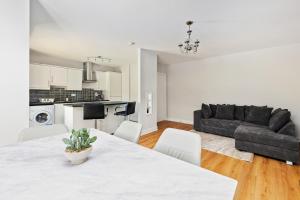 a living room with a table and a couch at South Dublin Oasis in Dublin
