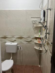 a bathroom with a toilet and a shower in it at Opening promo Taman Seri Lalang Kluang in Kluang