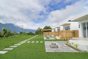 a view of a house with a yard at Pandawa Glamping Kintamani in Bangli