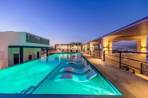a swimming pool on the roof of a building at Cabo Penthouse Rooftop Pool Walk to Marina in Cabo San Lucas