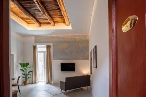TV a/nebo společenská místnost v ubytování Residenza boutique Portici 29 II