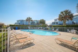 The swimming pool at or close to Navigating Our Destiny- The Perfect Beach Getaway!