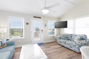 A television and/or entertainment centre at Navigating Our Destiny- The Perfect Beach Getaway!