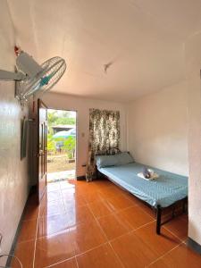 a bedroom with a bed in a room at Angel Gabriel Homestay in Coron