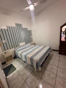 Postel nebo postele na pokoji v ubytování Hospedaje Artigas