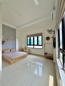 Ένα ή περισσότερα κρεβάτια σε δωμάτιο στο Haly Homestay